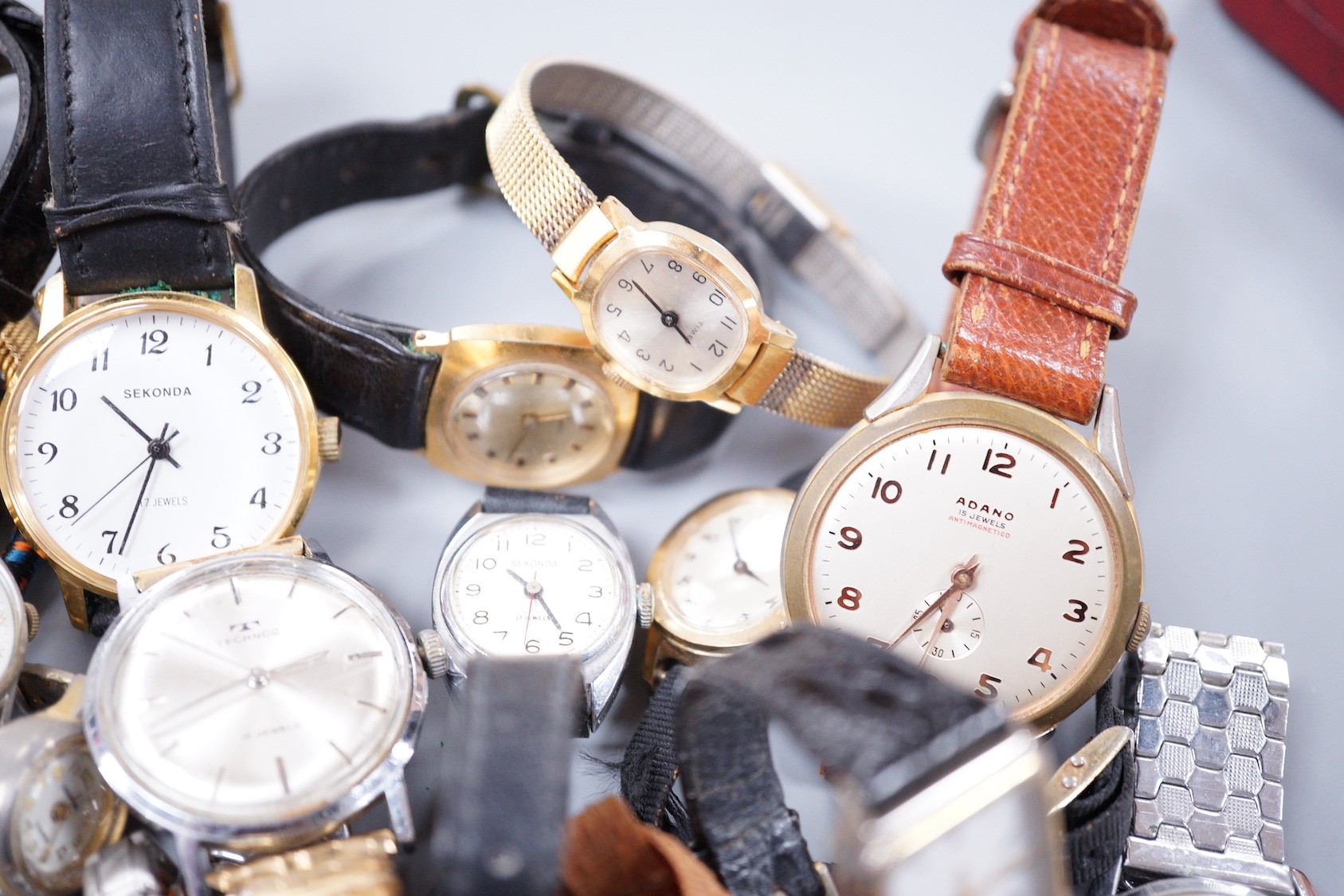 Seven assorted gentleman's wrist watches including steel Ingersoll and steel Technics, Adano and Sekonda and twelve assorted lady's wrist watches including Timex, Editia and a yellow metal Winegartens.